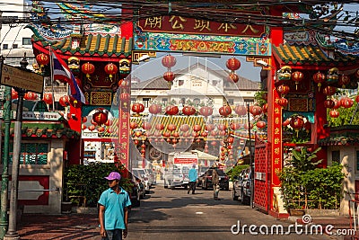 BANGKOK, THAILAND February 14, 2019: Traditional Chinese style temple, view from the street with asian passersby Editorial Stock Photo