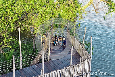 BANGKOK,THAILAND-FEBRUARY 23,2020 : Unidentified group of Asian friends or travelers using a smartphone or mobile phone take photo Editorial Stock Photo