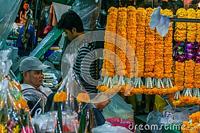 Interior of the market of flowers and fruits. Professions of local people. Editorial Stock Photo