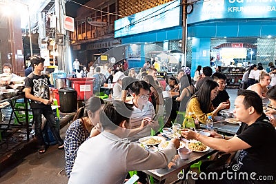 Bangkok, Thailand, January 12, 2018: Many people eating street food on the lively Yarowat Road, also known as Chinatown Editorial Stock Photo