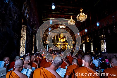 People and Monks praying Buddha in Wat Rakhang Kositaram Editorial Stock Photo