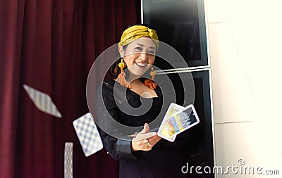 A gypsy woman is throwing tarot cards Editorial Stock Photo