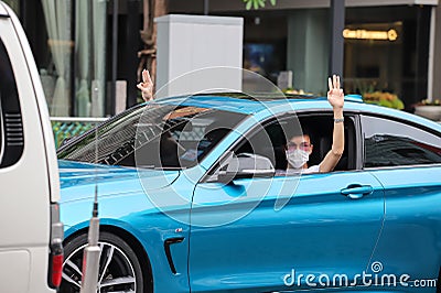 `Car Mob` Protesters a three finger salute to show symbolic gestures between driving vehicles and honk. Editorial Stock Photo