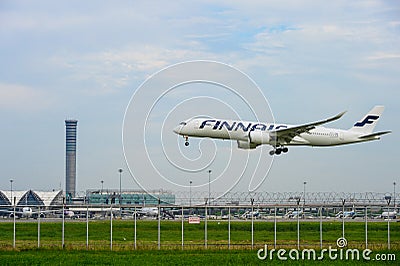 Finnair airplane landing to runways at suvarnabhumi international airport in Bangkok ,Thailand. Editorial Stock Photo