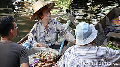 BANGKOK, THAILAND, 13 JULY 2019 Lat Mayom floating market. Traditional classic khlong river canal, local women in long-tail boats Editorial Stock Photo