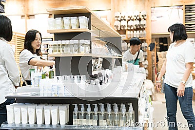 Bangkok, Thailand - July 29, 2017: Many women are standing buying cosmetics skin care at cosmetics shop. They choose the required Editorial Stock Photo