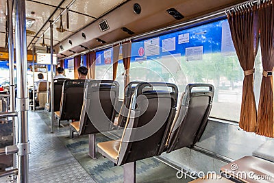 Thailand shuttle bus seat in back view. Bangkok Thailand Public mass transportation in summer vibe before Covid-19 epidemic Editorial Stock Photo