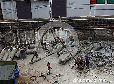 People working at a construction site Editorial Stock Photo