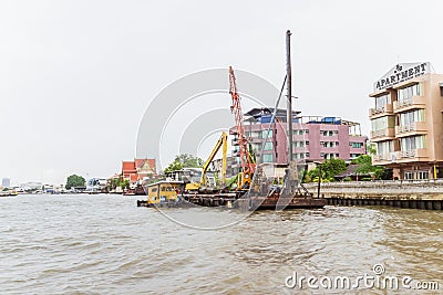 Bangkok, Thailand - June 5, 2016: Boat for driving piles into ri Editorial Stock Photo