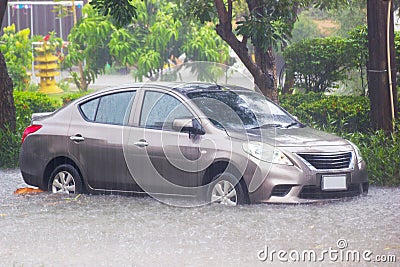 Bangkok Thailand :- June 5, 2017 : Car driving flood water, it`s raining heavily hard, Some of the flooded area is flooded up unt Editorial Stock Photo