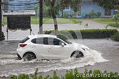 Car driving flood water, it`s raining heavily hard, Some of the flooded area is flooded Editorial Stock Photo