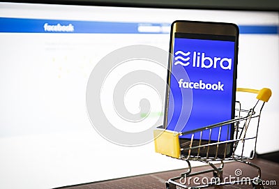 Libra coin blockchain concept with smartphone on shopping cart / New project libra a cryptocurrency launched by Facebook looks to Editorial Stock Photo
