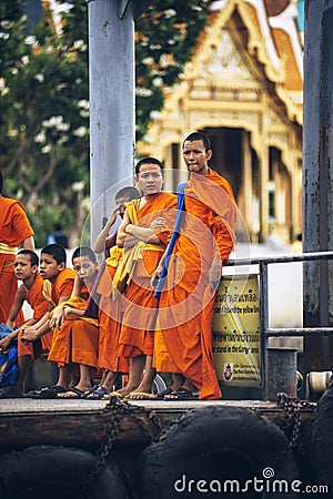 BANGKOK, THAILAND - JUNE 27, 2015: Novice Buddhist monks stand w Editorial Stock Photo