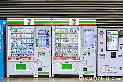 7 eleven with TAO BIN automatic vending machines are available for customers inside of Bangkok train terminal station building Editorial Stock Photo