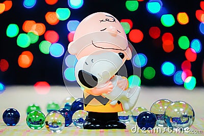 Toy From McDonald`s Happy Meal with marbles and colorful night light bokeh Editorial Stock Photo