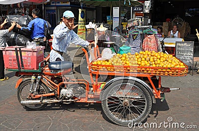 Bangkok, Thailand: Man Selling Oranges Editorial Stock Photo