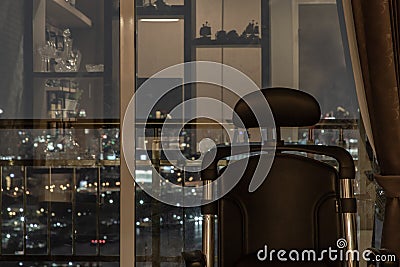 Comfort chair in Living room and City view at home, condominium in the evening Stock Photo