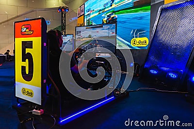 Bangkok, Thailand - March 31, 2019 : Gamers driving simulation car with reality screen E Sport technology game GP e-racing game at Editorial Stock Photo