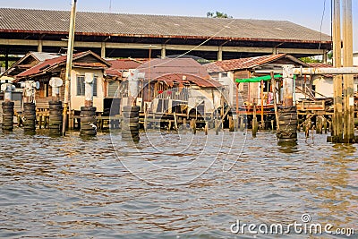 BANGKOK, THAILAND, MARCH, 23, 2018: Outdoor view of floating poor houses with neumatics inside of metallic struture on Editorial Stock Photo