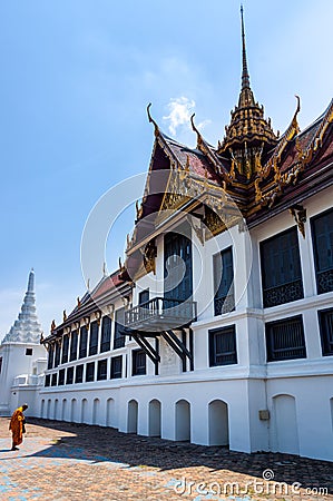 Bangkok, Thailand, March 2013 Single Thai monk praying in front of Grand Palace Editorial Stock Photo