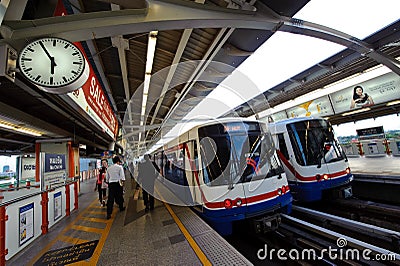 Bangkok, Thailand - May 6, 2011 : People queing, standing in lines waiting and walking into BTS sky train at Mochit station on May Editorial Stock Photo
