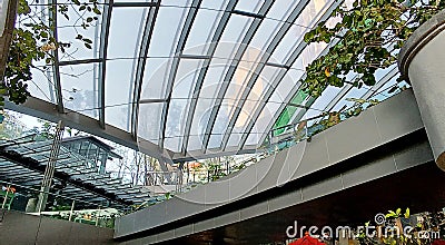 Perspective of indoor garden between shop under skylight roof at True digital park building Editorial Stock Photo