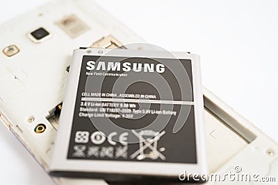 BANGKOK,THAILAND. MAY 1 2023 technician repairing and insert battery for Smartphone SAMSUNG Editorial Stock Photo