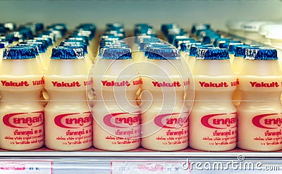 BANGKOK, THAILAND - NOVEMBER 28: Foodland supermarket fully stocks Yakult yogurt drinks in the refrigerated section in Bangkok on Editorial Stock Photo