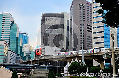 Modern urban image with BTS skytrain transport and skyrise buildings central Bangkok Thailand Editorial Stock Photo