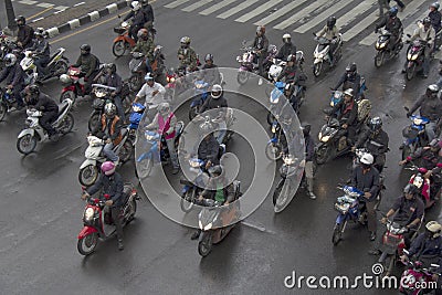 BANGKOK, THAILAND OCT 11TH: Motorcyclists wait at traffic lights Editorial Stock Photo