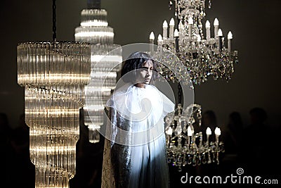 Fashion Show of Wedding dress and Evening Gown along Chandelier Editorial Stock Photo