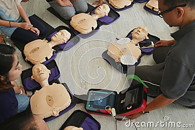 BANGKOK, THAILAND - OCTOBER 6, 2019 : a part of trainee , participant of CPR First Aid Training course using hand pump on dummy Editorial Stock Photo