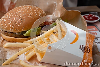 Bangkok, Thailand - October 11th, 2019 : Closed up of Burger King's french fries and burger on brown paper Editorial Stock Photo