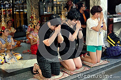 Bangkok, Thailand: People Praying at Erawan Shrine Editorial Stock Photo