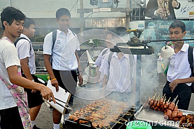 Bangkok, Thailand: Schoolboys Buying Food Editorial Stock Photo