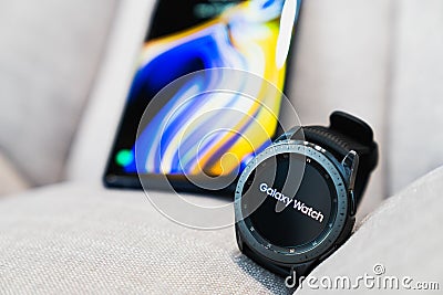 Bangkok, Thailand - Sep 28, 2018: Smartwatch Samsung Galaxy Watch 42mm midnight black paired with Samsung Galaxy Note 9 Editorial Stock Photo