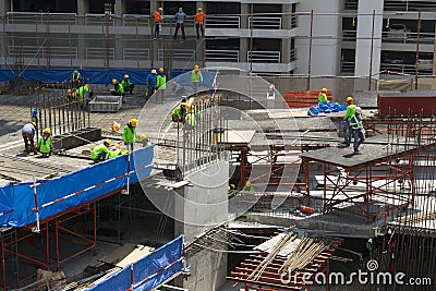 Unidentified construction workers working at high level of construction site in Bangkok,Thailand Editorial Stock Photo