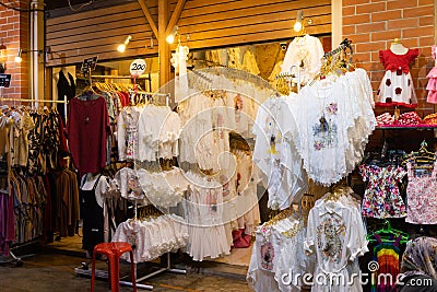 White clothing shop at night market Editorial Stock Photo