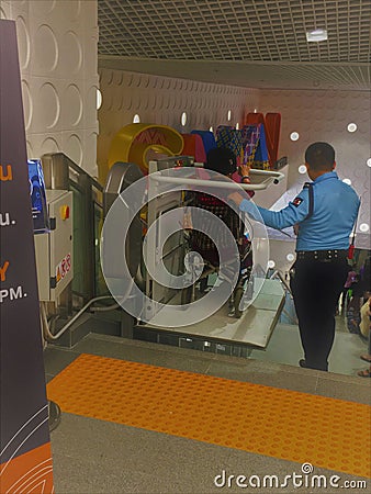 Bangkok,Thailand-September 14,2019: Samyan Mitrtown shopping mall have Seat down the stairs for older person Editorial Stock Photo