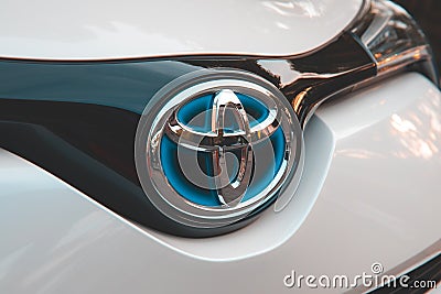 Toyota logo on grey Toyota CHR car front. Editorial Stock Photo