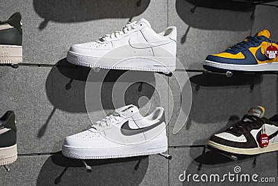 White Nike Air sneakers displayed in a shop Editorial Stock Photo