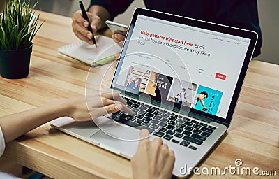 Bangkok, Thailand - September 6, 2017 : Women use laptop with show screen Airbnb application. Airbnb is a website for people Editorial Stock Photo