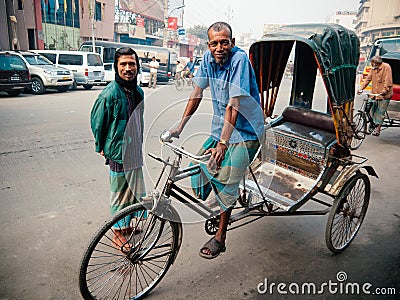 Bangladesh people and rickshaw tricycles driver on Dhaka city dusty street Editorial Stock Photo