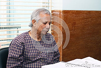 Muhammad Yunus is listening to the discussion at a conference at Grameen centre, Dhaka Editorial Stock Photo