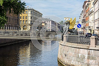 Bank bridge with golden-winged griffons over Griboyedov canal, Saint Petersburg, Russia Stock Photo