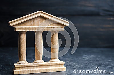Bank. State Building. wooden government building on a black background. concept of state administration and economic institutions. Stock Photo