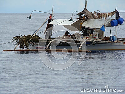 Bangkas, a traditional type of outrigger boats used by Filipino artisanal fishermen Editorial Stock Photo