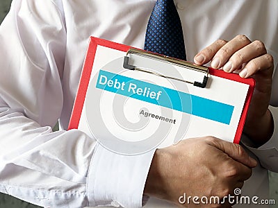 The banker holds the Debt relief agreement. Stock Photo