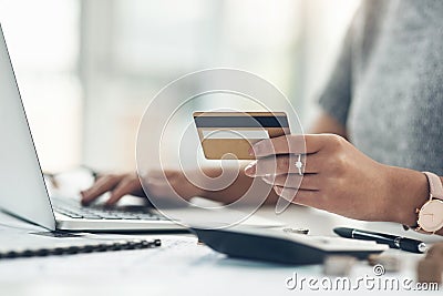 Banking, payment and paying bills online with ebanking on a laptop with a credit or debit card. Closeup of a woman doing Stock Photo