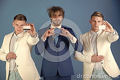 Banking services. Businessmen showing visiting and bank cards Stock Photo